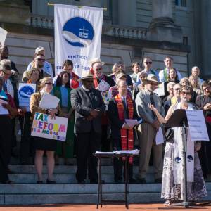 The Rev. Dr. Peggy Hinds, interim director of the Kentucky Council of Churches, speaks during ‘Higher Ground Moral Day of Action’ on the steps of the Kentucky State Capitol. (Photo by Gregg Brekke)