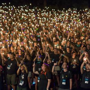 Presbyterian Youth Triennium participants hold candles high at the conclusion of Friday evening's worship service. (Photo by Gregg Brekke)