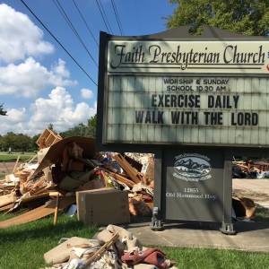 Rubble taken from the church sits outside Faith Presbyterian Church in Baton Rouge, Louisiana. (Photo by Paul Seebeck)