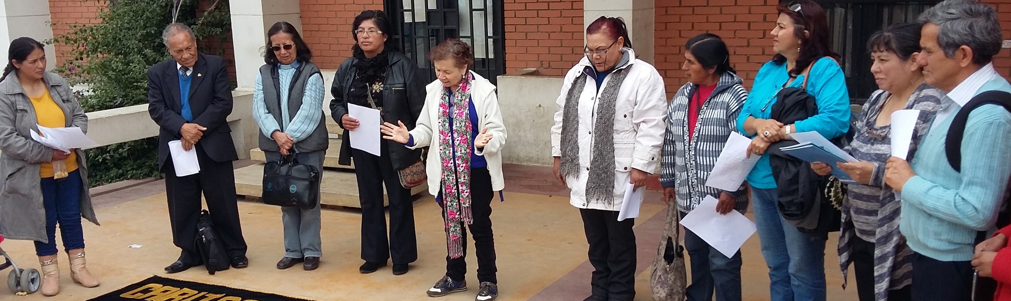 Group praying in Peru