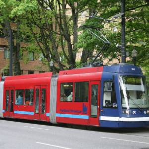 A car of the Portland Streetcar system at the eastbound Portland State University stop, on Market Street at the South Park Blocks. Photo by Cacophony, via Wikimedia