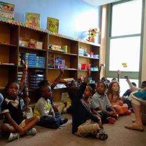 Third Church tutoring coordinator Sue Maddock with one of the elementary school tutoring programs in Rochester. (Photo by Linc Spaulding)