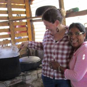 Sarah Henken takes a turn stirring soup with her friend Eunice, one of over 6 million internally displaced persons who are victims of the armed conflict in Colombia. (Photo by Rosaline Maria)