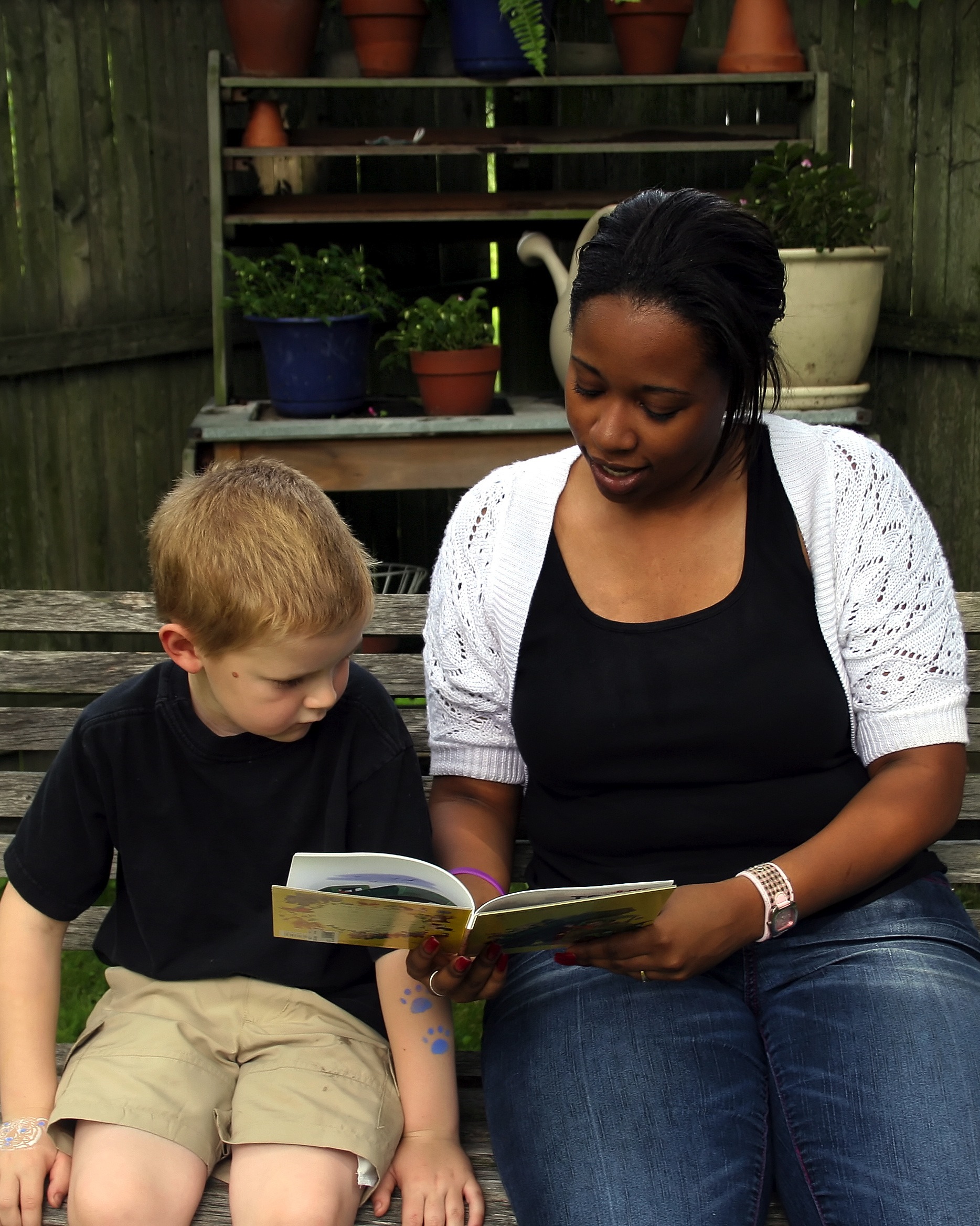 Woman reading to young child