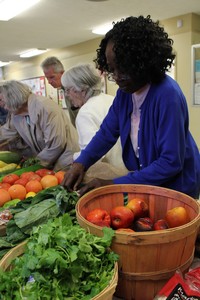 Woman choosing fresh vegetables