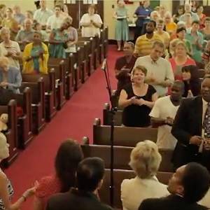 church congregation standing during worship