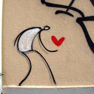 Graffiti of stick figure holding a heart