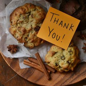 An assortment of baked goods with a tag that says Thank you!