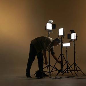 Man checking photography lights