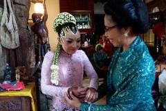 Farsijana helping Tina with her bridal preparations.