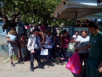 Families are happy to receive sugar, flour, oil, and sweets for the children.