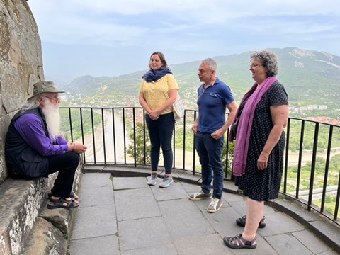 Luciano, Meg and Ellen listen to Bishop Malkhaz share the history around us at an ancient monastery.