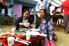 Alyson Kung (right), a Young Adult Volunteer in Korea, shares a meal with Hyeon Ju Yoon and other volunteers after chestnut picking. Photo credit: William Loder