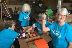 At the Board of Religious Organizations, the service group packed boxes for distribution to children for Christmas.