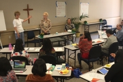 (left to right) Faith Community Nurses Carmen Enz and Jean Harlow, and Rev. Aart van Beek (who often translated during the sessions) share on the topic of “Models of Faith Community Nursing”