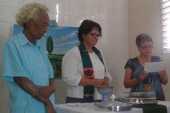 Josey serving the Lord's Supper with Rev. Beidi Casas and an elder