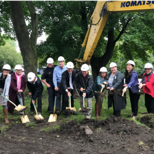 folks with shovels breaking ground for the new affordable units