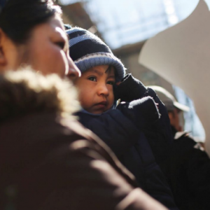 woman with child at rally