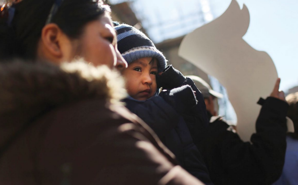 woman with child at rally