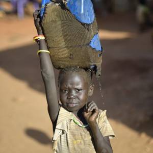 Boy carrying clothes