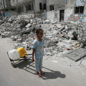 Palestinian girl dragging water containers